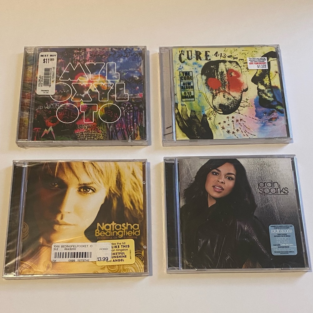 CDs lot new in wrappers. Cold Play, The Cure, Natasha Bedingfield, Jordan Sparks